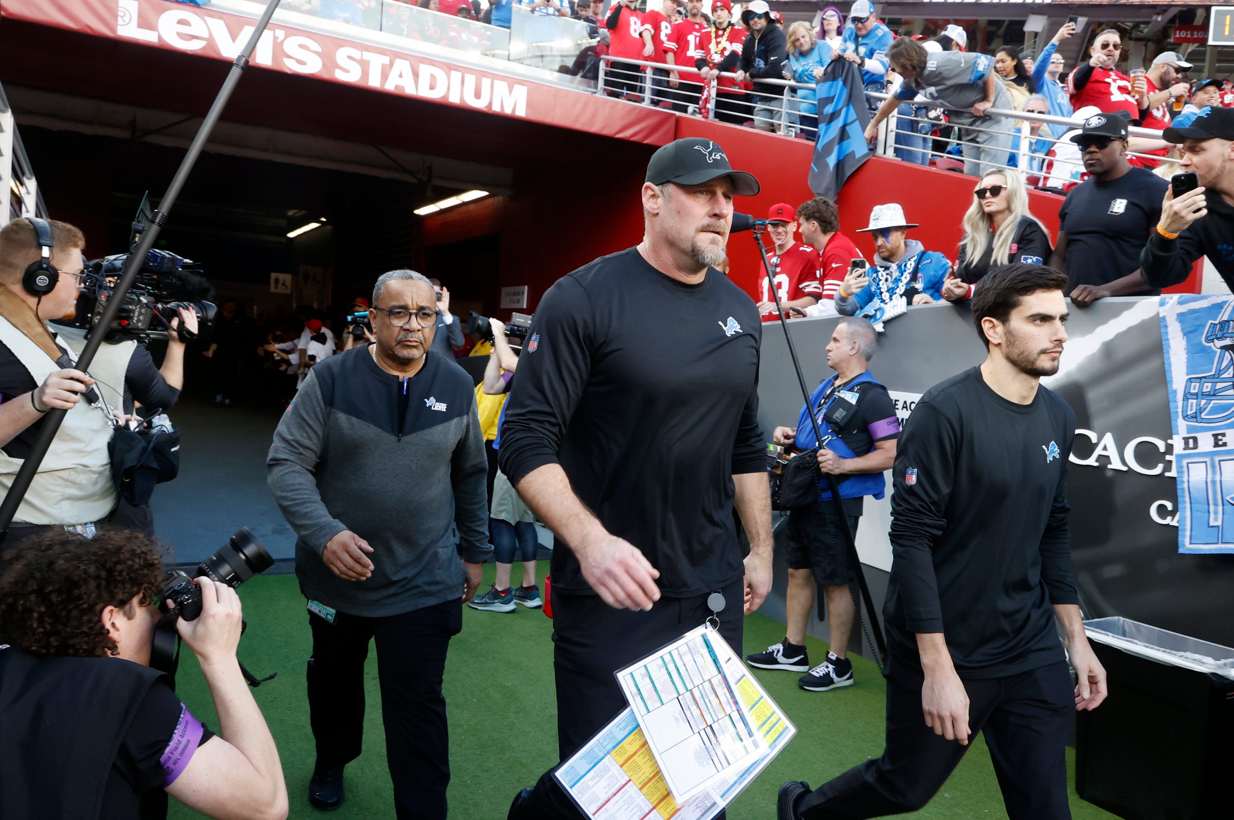 Dan Campbell walks out onto the field