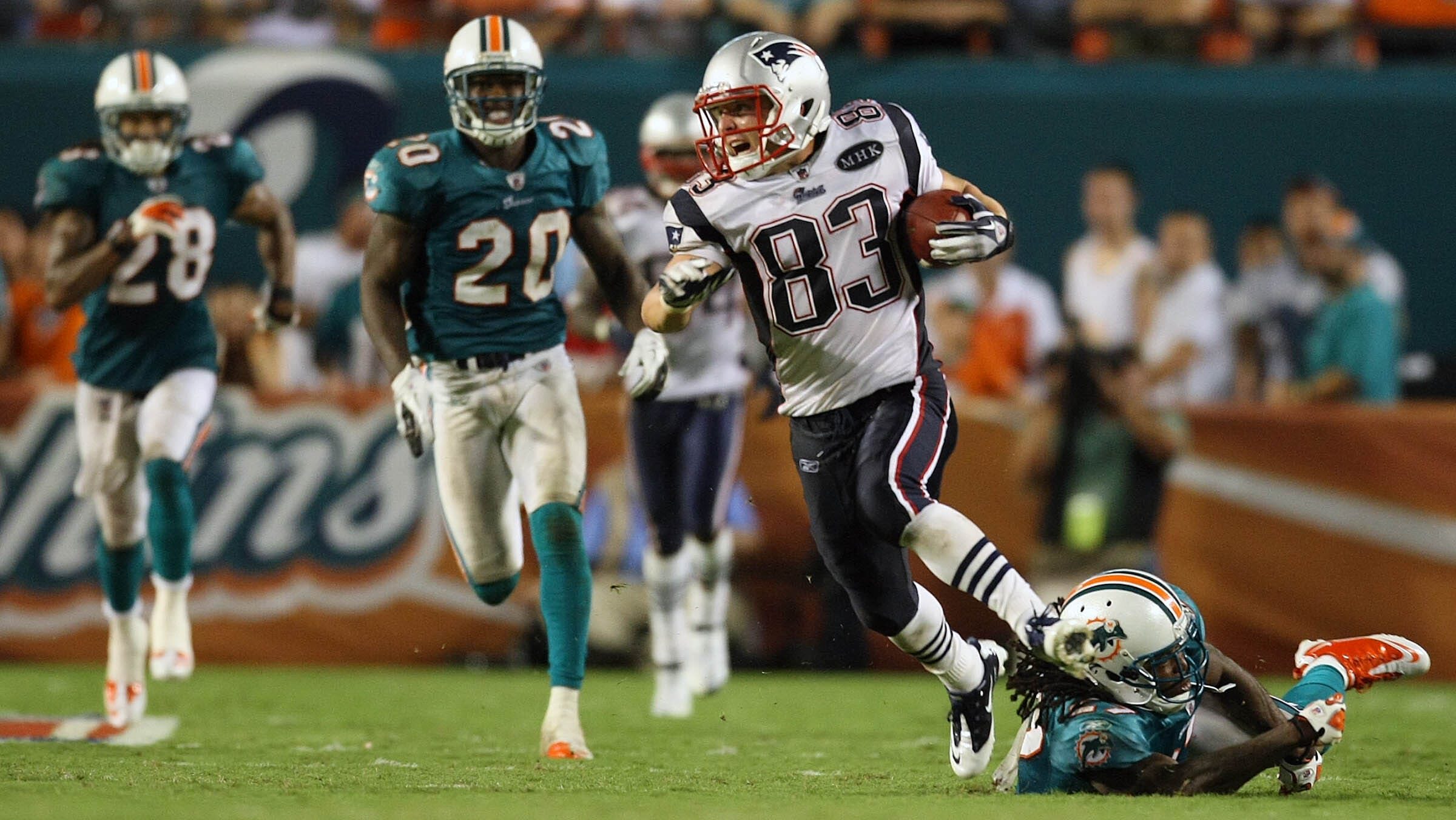 Wes Welker breaks a tackle from a Miami Dolphins defender