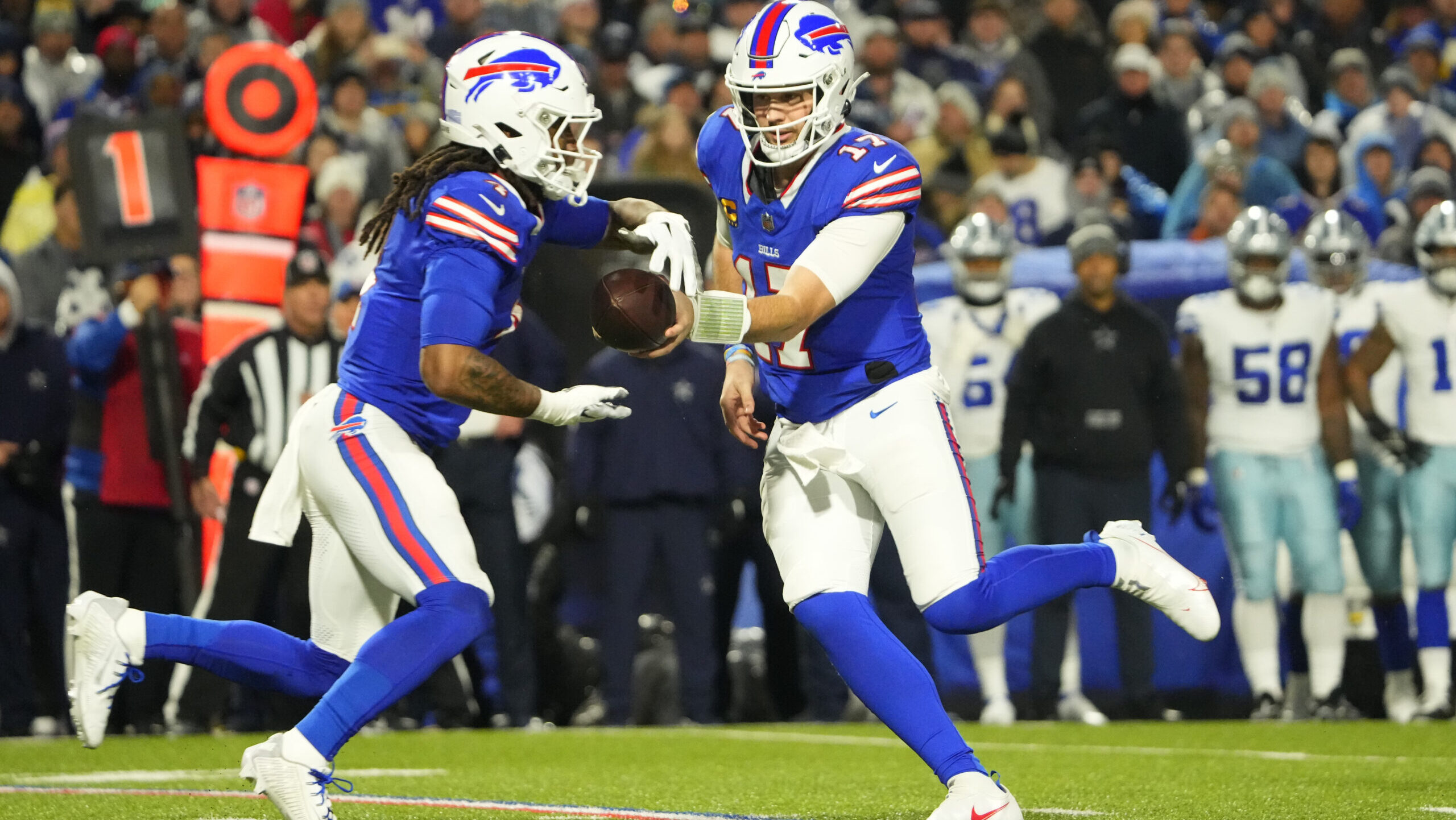 Buffalo Bills running back James Cook, left, and quarterback Josh Allen