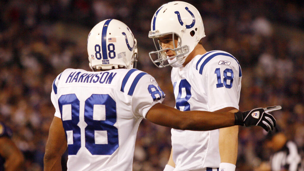 Peyton Manning and Marvin Harrison speak before start of play.