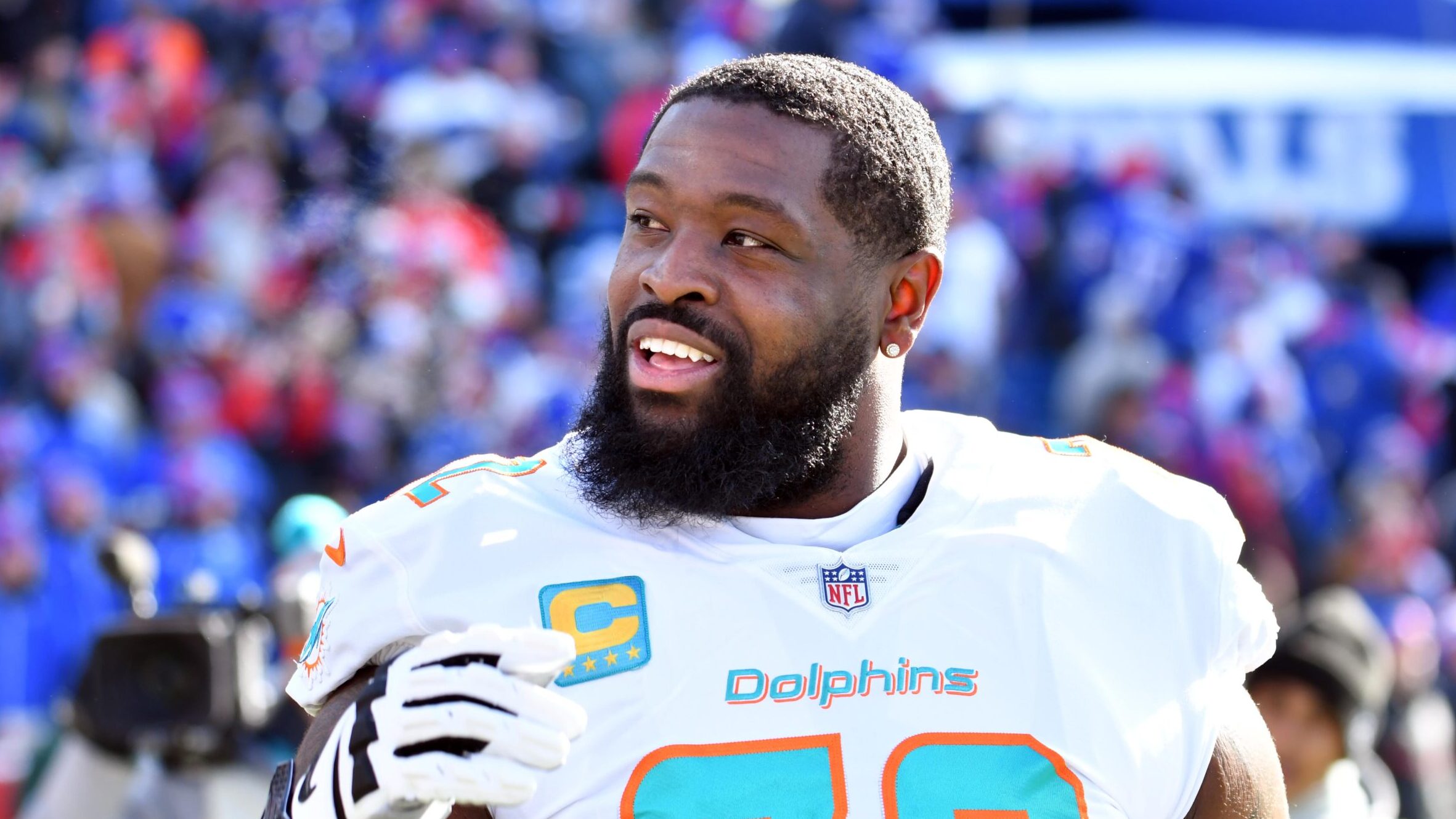 Dolphins OL Terron Armstead smiles with his helmet off.