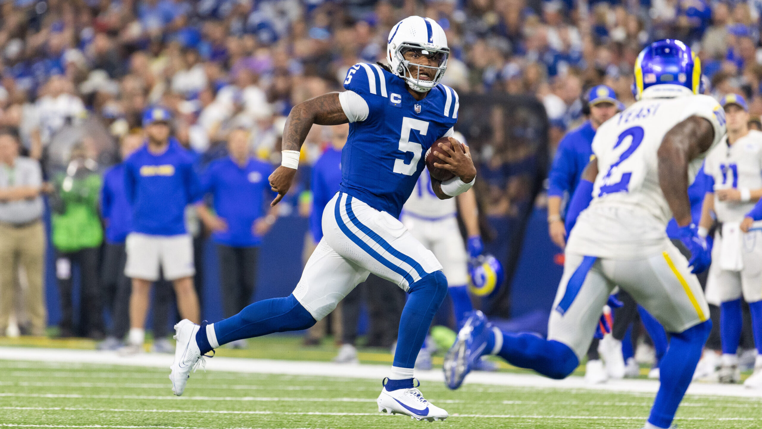 Colts QB Anthony Richardson runs away from Los Angeles Rams defender