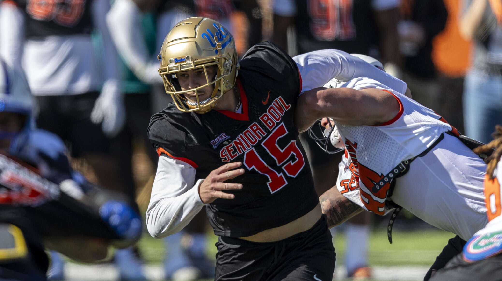 UCLA DE Laiatu Latu rips through an offensive lineman during a Senior Bowl drill.