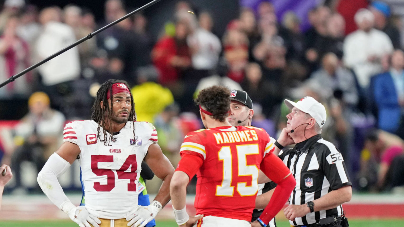Fred Warner stands with Patrick Mahomes for the overtime coin flip in Super Bowl LVIII.