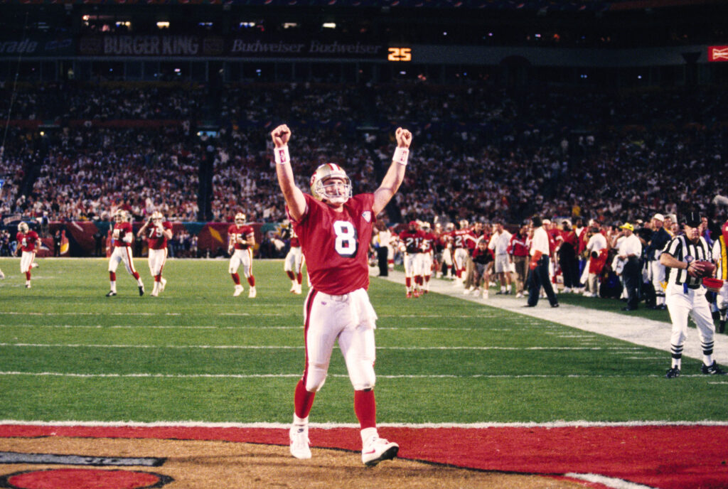 Steve Young celebrates in the end zone