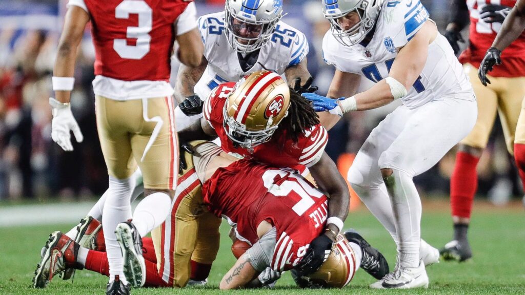 San Francisco 49ers tight end George Kittle recovers an onside kick against the Detroit Lions