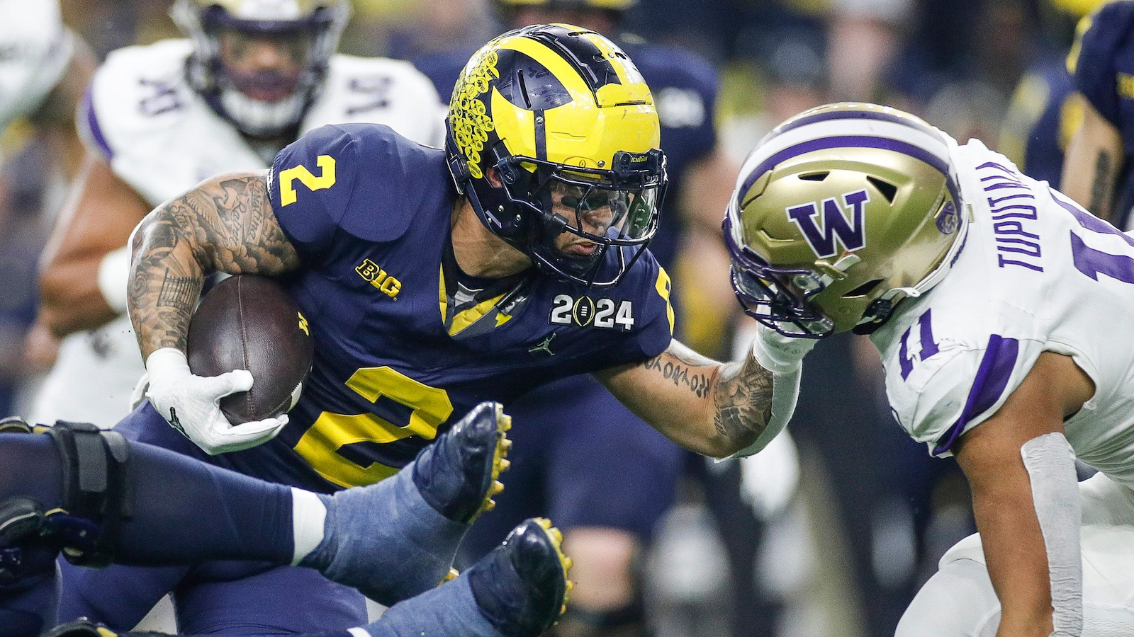 Michigan RB Blake Corum rushes against Washington in the College Football Playoff title game