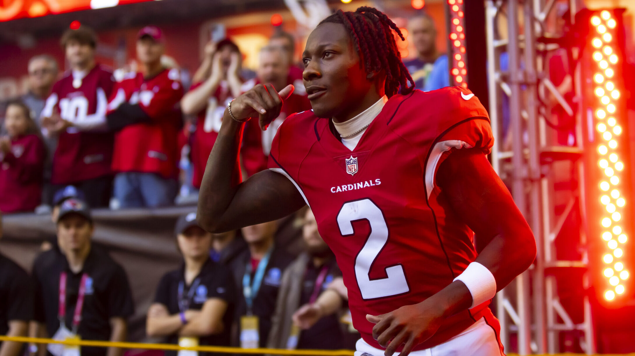 Marquise Hollywood Brown runs out of the Cardinals' tunnel.