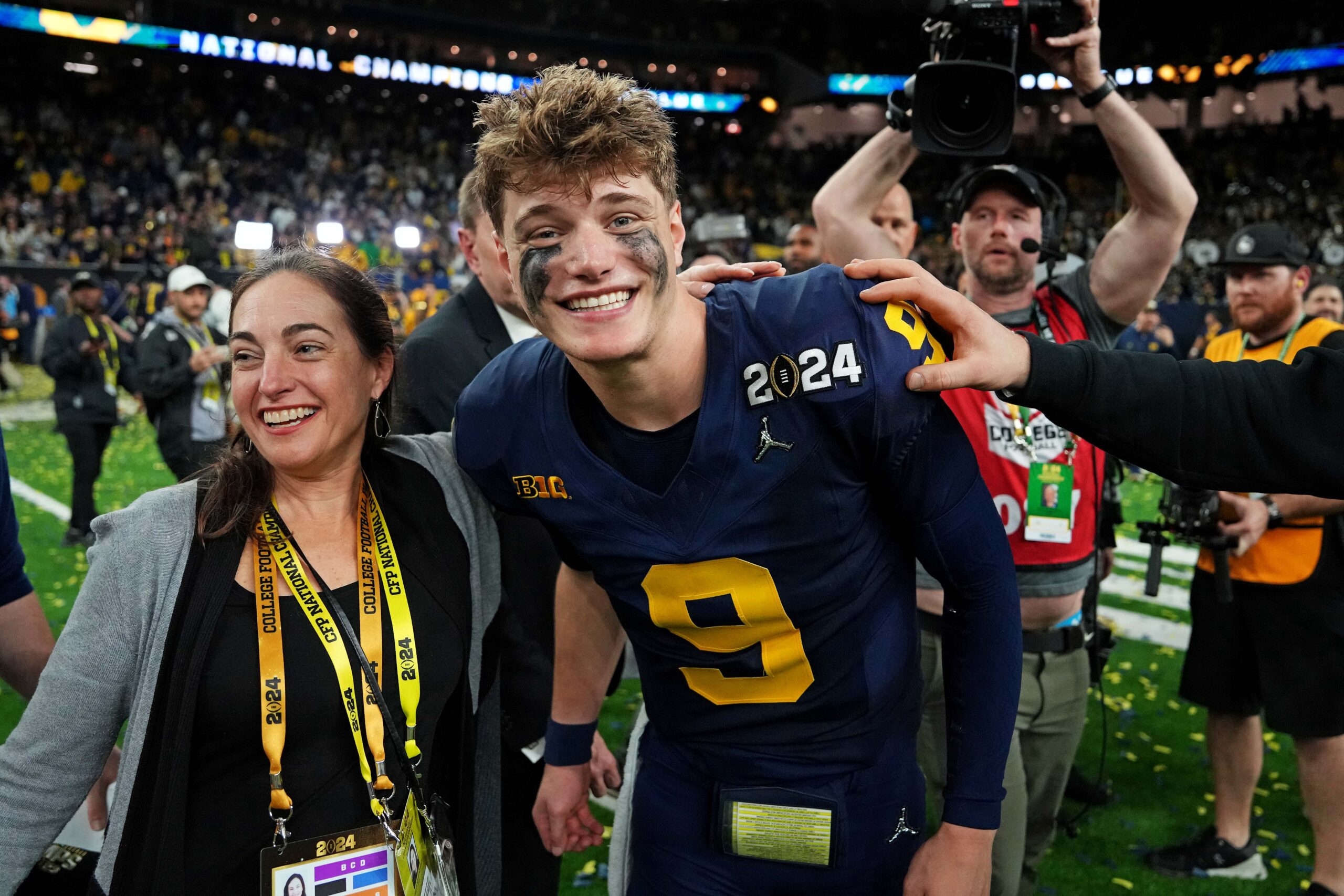 J.J. McCarthy smiles into the camera following Michigan's National Championship win