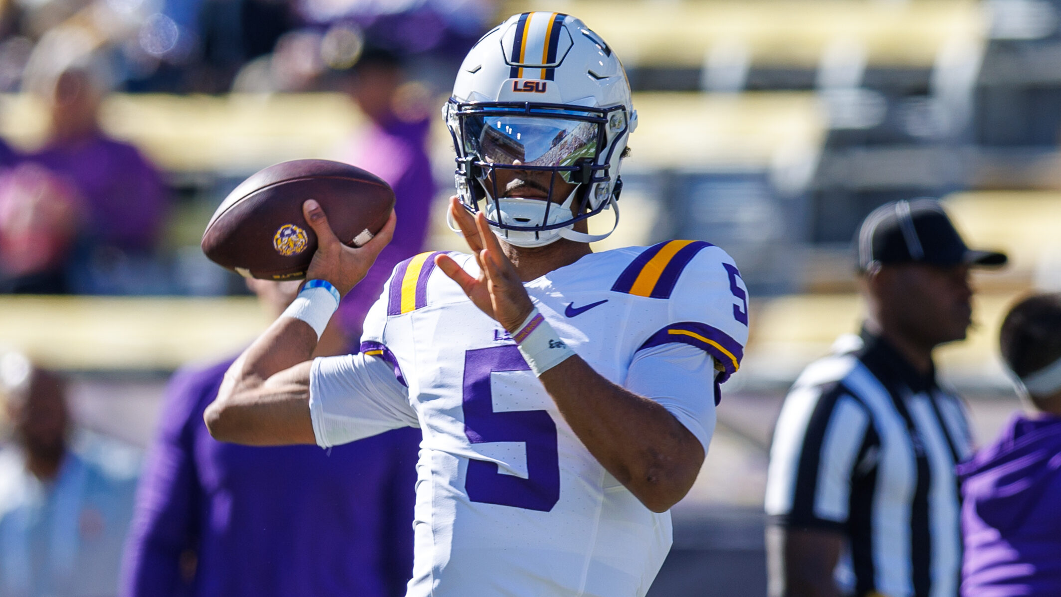 LSU Quarterback Jayden Daniels throws a pass pre-game