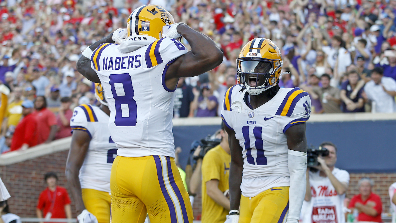 LSU receivers Malik Nabers and Bryan Thomas Jr. celebrate a touchdown