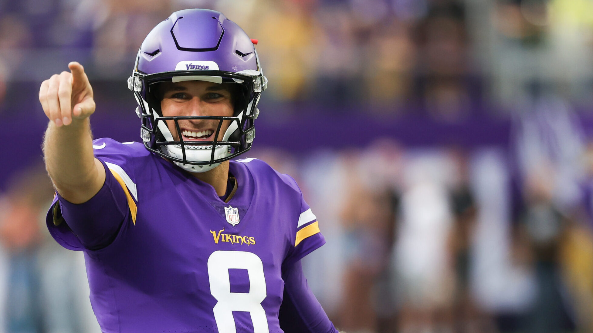 Vikings QB Kirk Cousins points in direction of camera