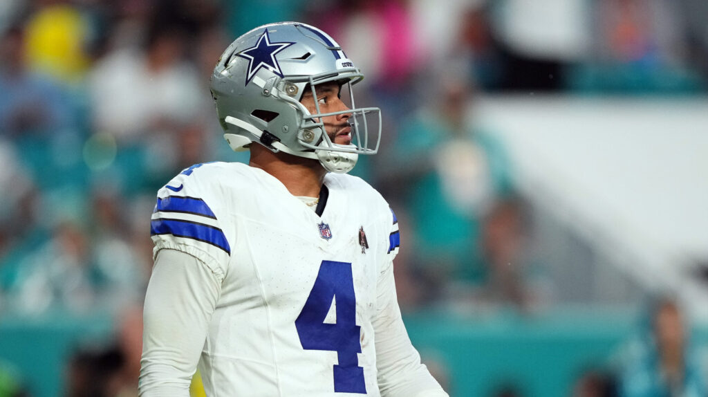 Cowboys QB Dak Prescott looks out as he walks off the field.