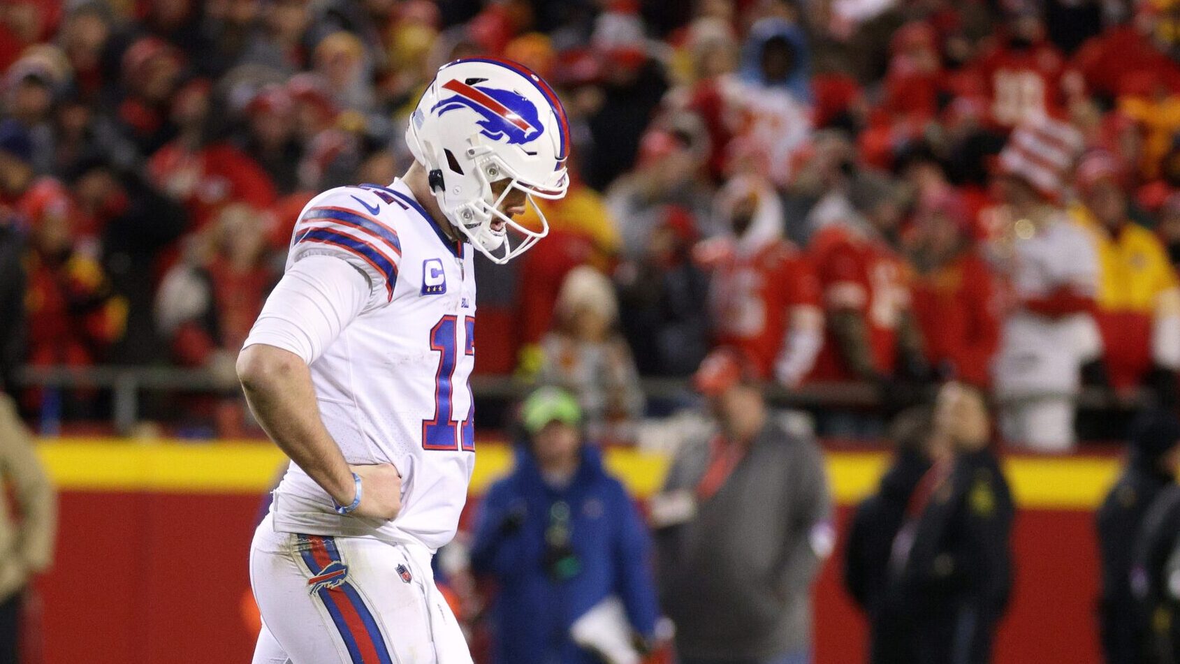 Bills QB Josh Allen walks with his head down.