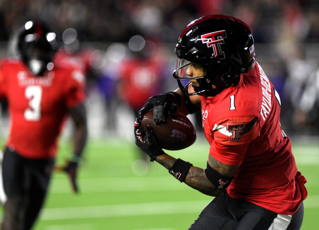 Texas Tech safety Dadrion Taylor-Demerson catches pass during pre-game warmups