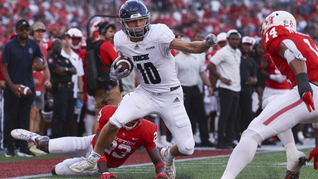 Luke McCaffrey stiff-arms Houston tacklers