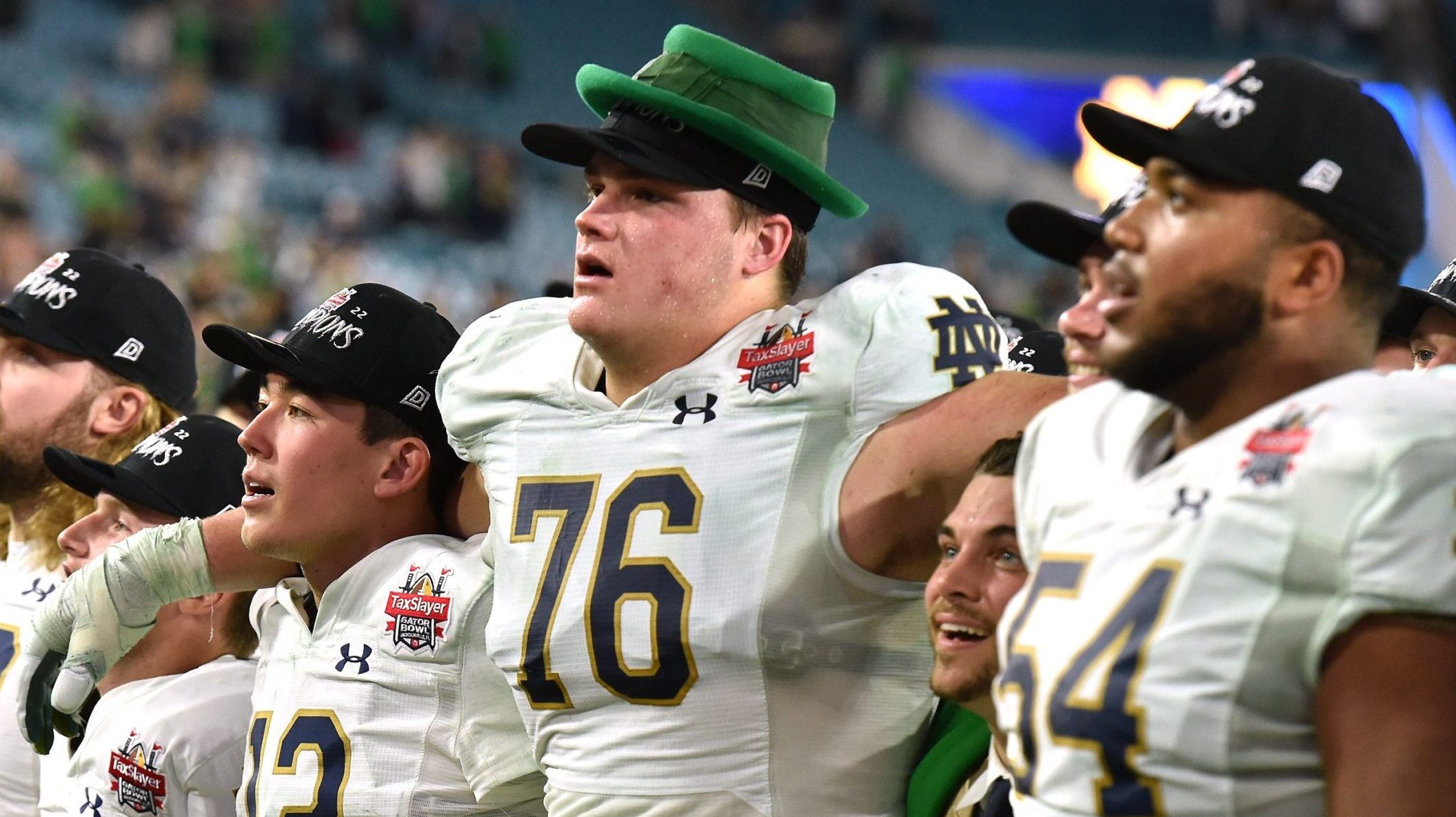 Notre Dame tackle Joe Alt stands with his teammates after a win in the Gator Bowl