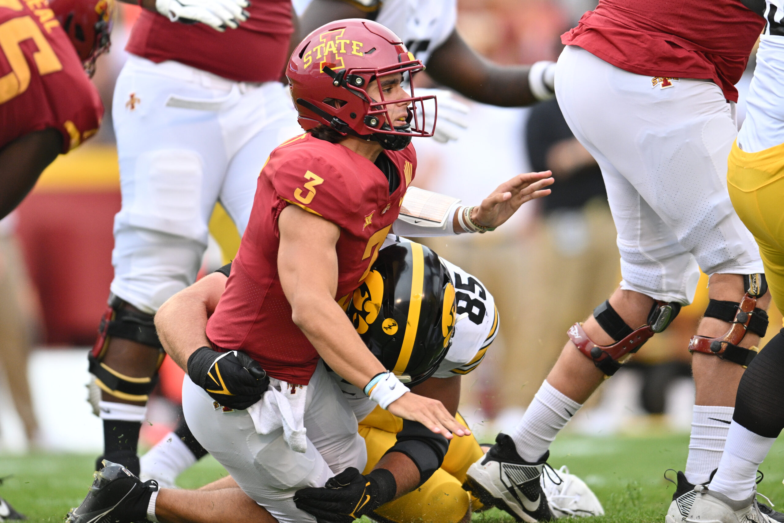 Logan Lee brings down the Iowa State quarterback