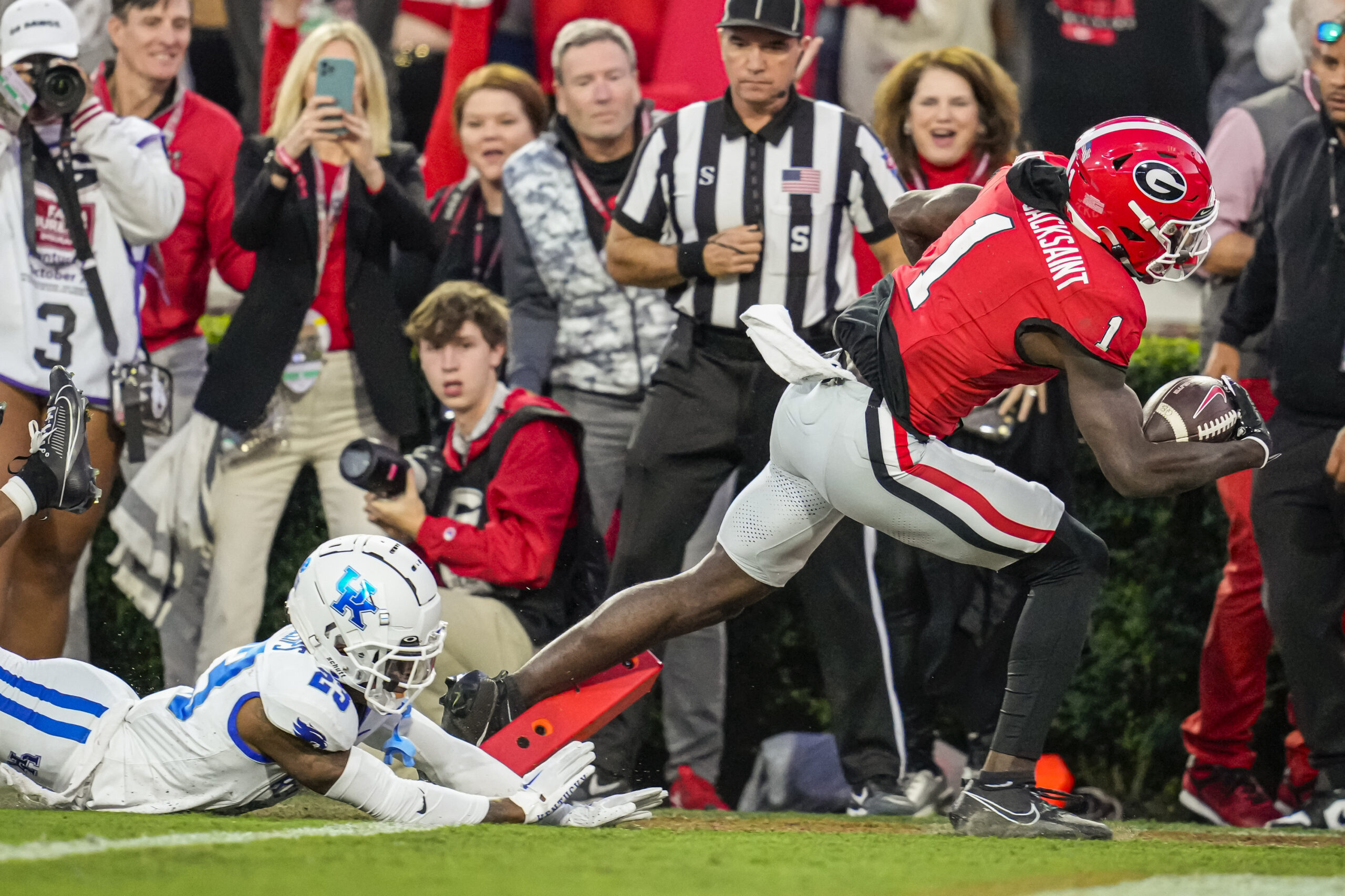 Marcus Rosemy-Jacksaint runs away from a defender for a touchdown