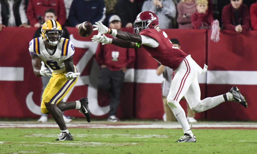 Terrion Arnold reaches his arms out and prevents the ball from reaching the arms of Malik Nabers