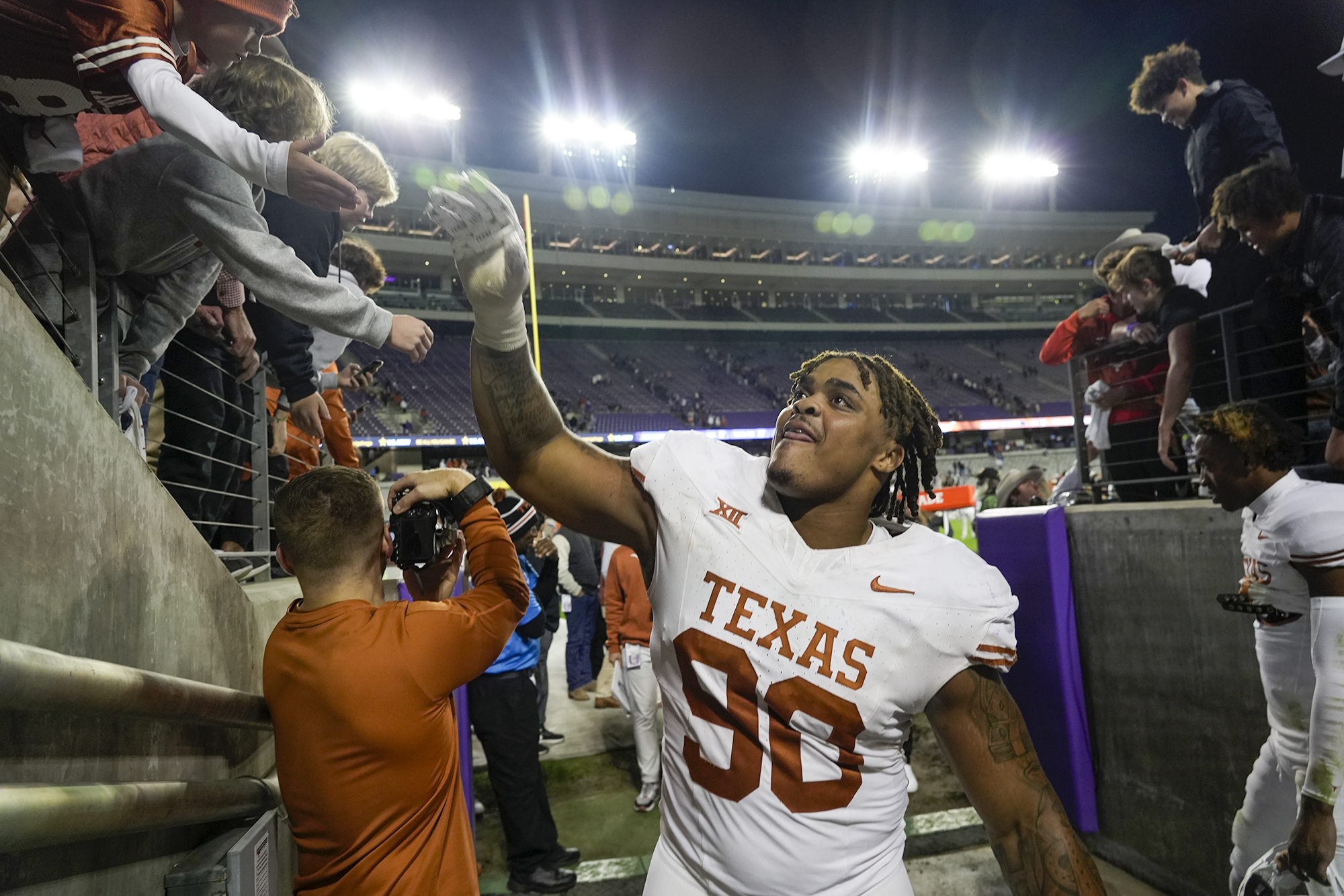 Byron Murphy II interacts with fans after the game