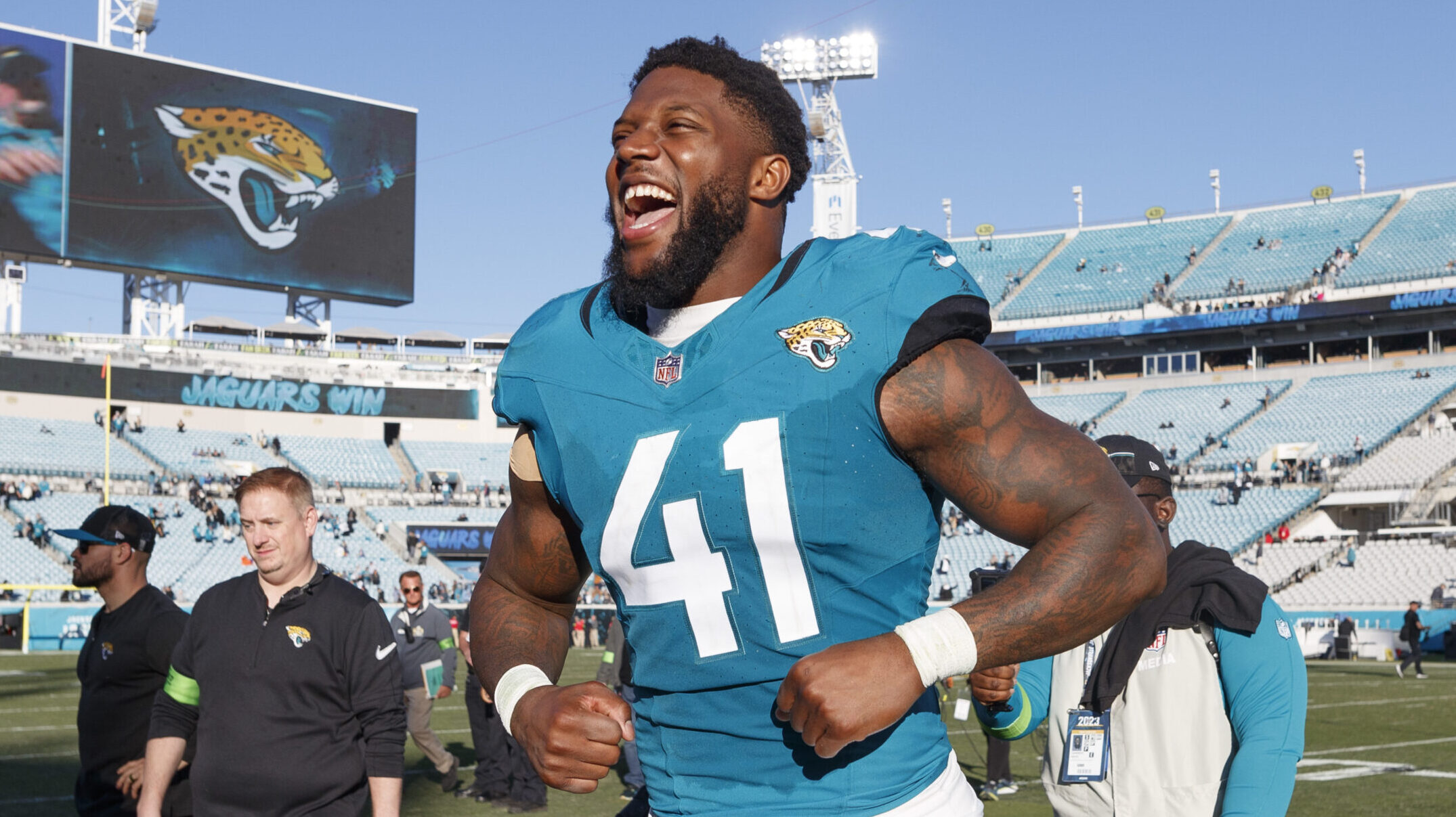 Jaguars Josh Allen celebrates win after the game.