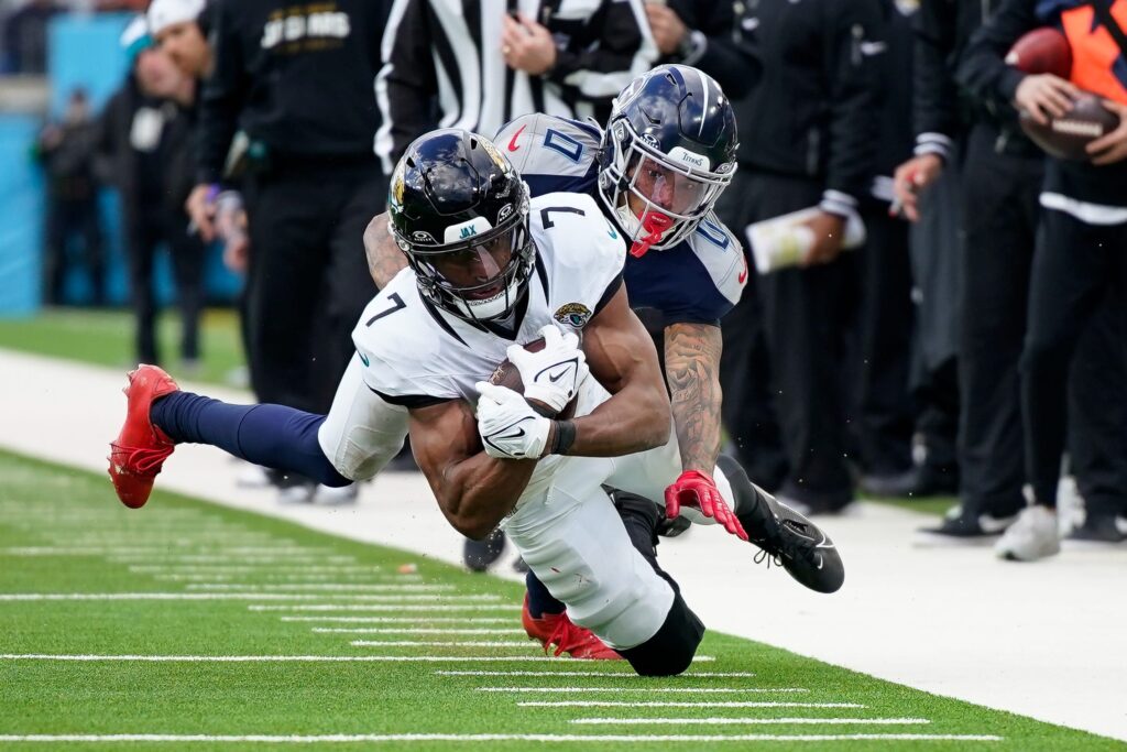 Jacksonville Jaguars WR Zay Jones catches a ball while falling to the ground. 