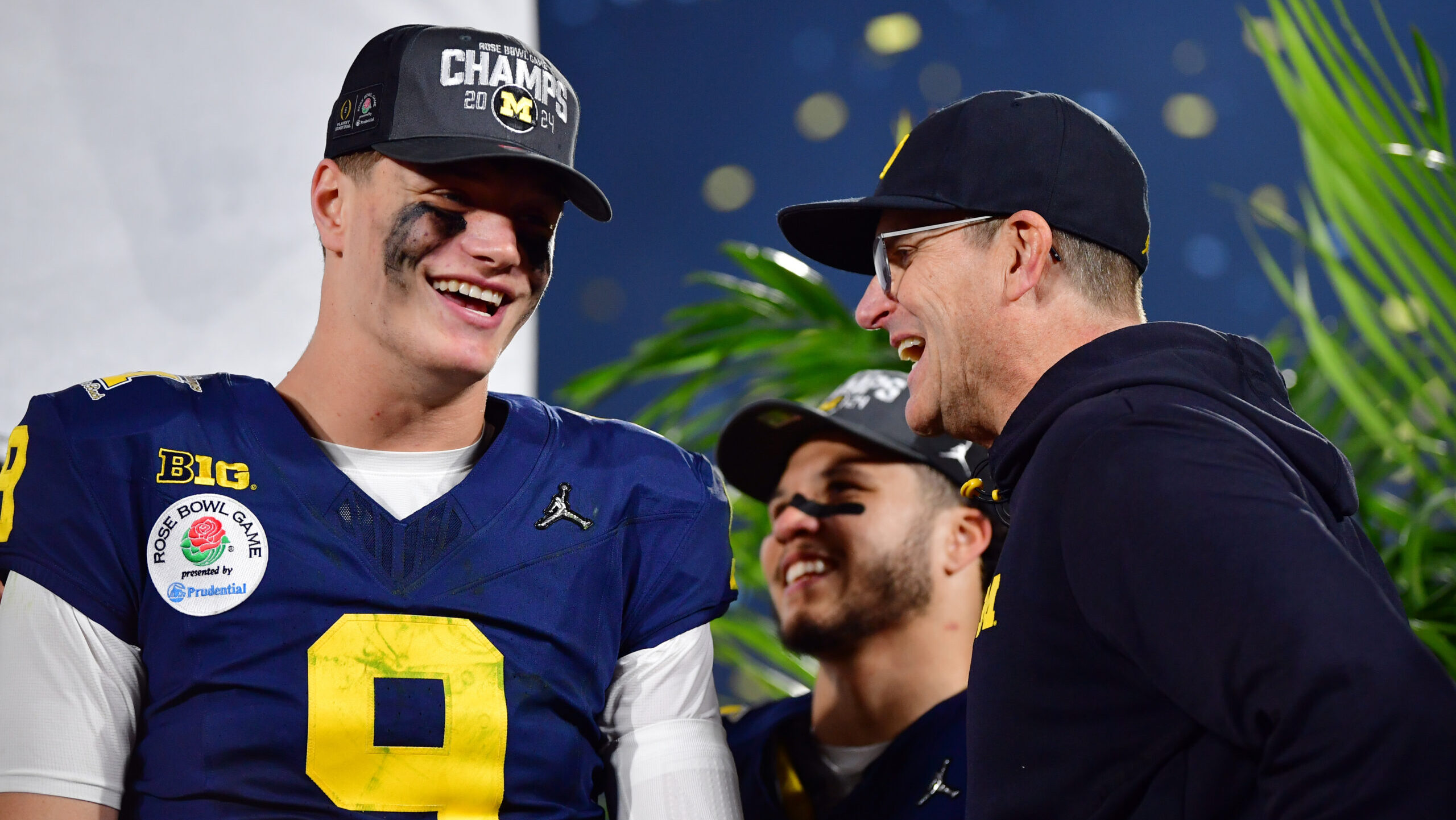 Michigan Wolverines quarterback J.J. McCarthy, left, and former coach Jim Harbaugh