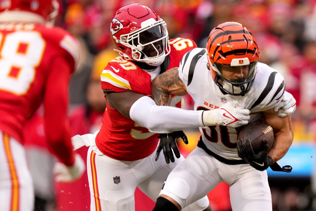 Bengals running back Chase Brown runs away from a tackle