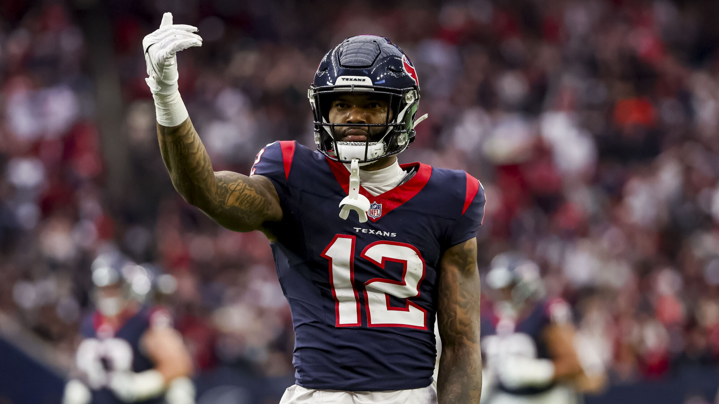 Texans WR Nico Collins celebrates after making a catch