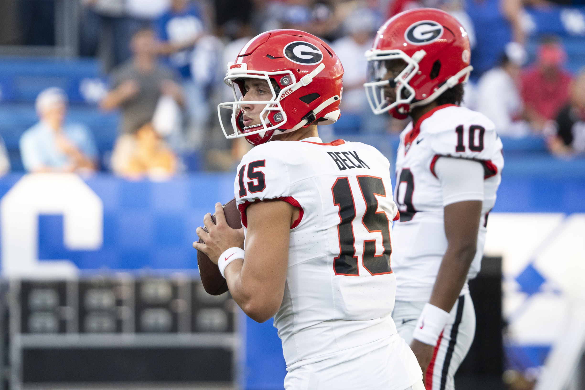 Georgia Bulldogs quarterback Carson Beck (15) warms up before the game against the Kentucky Wildcats at Kroger Field.