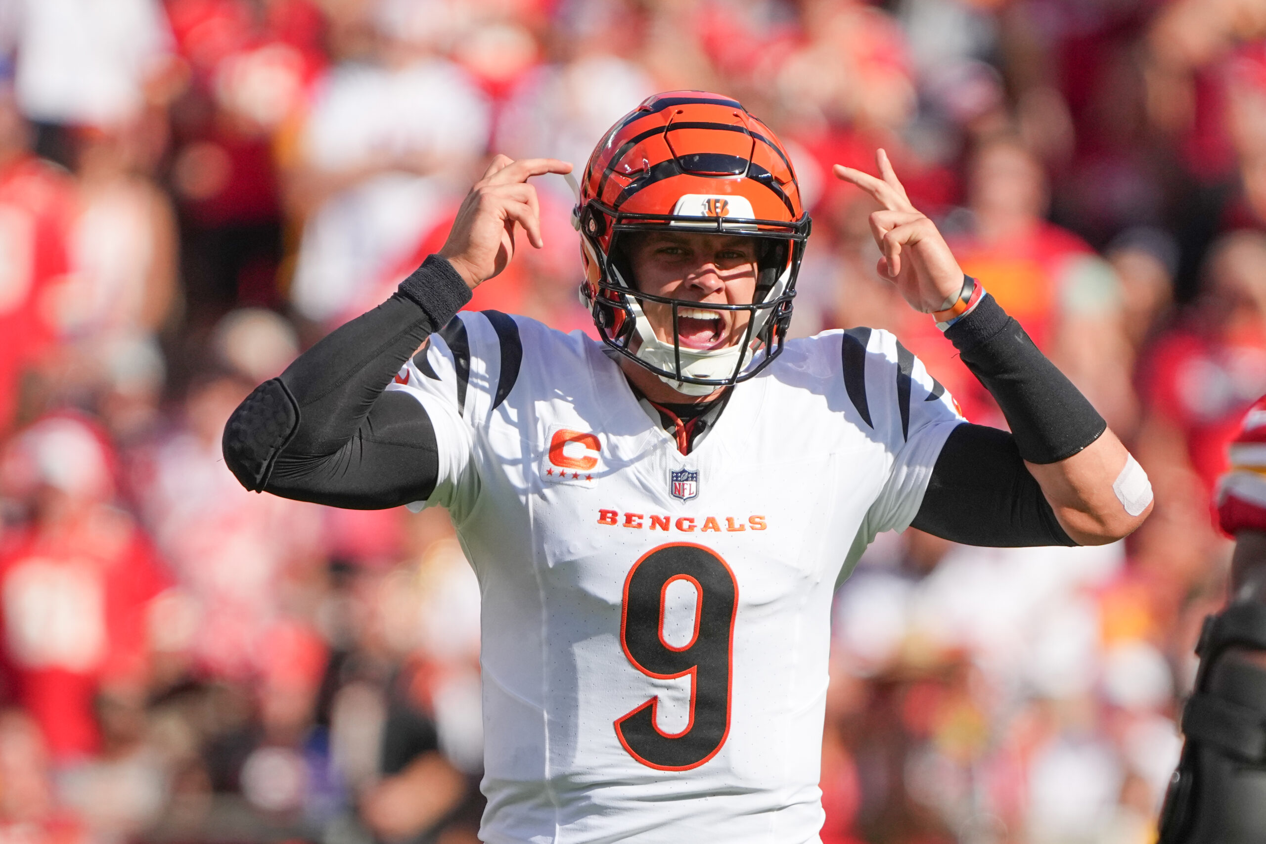 Cincinnati Bengals quarterback Joe Burrow gestures on the line of scrimmage against the Kansas City Chiefs during the first half at GEHA Field at Arrowhead Stadium.