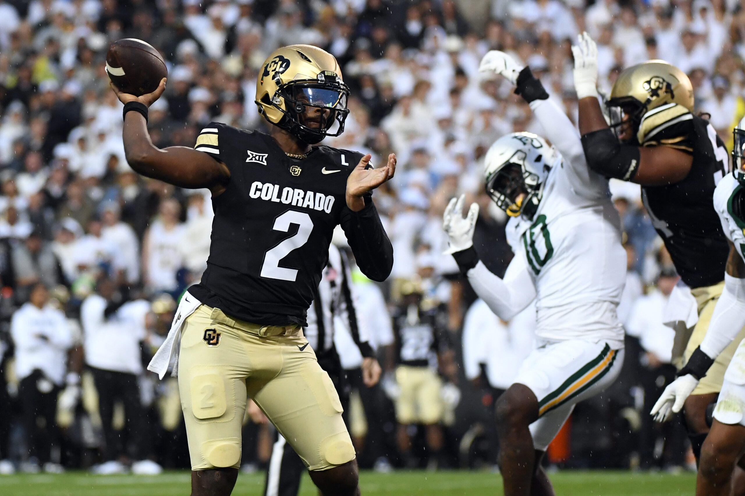 Colorado Buffaloes quarterback Shedeur Sanders (2) attempts a pass during the first half against the Baylor Bears at Folsom Field.