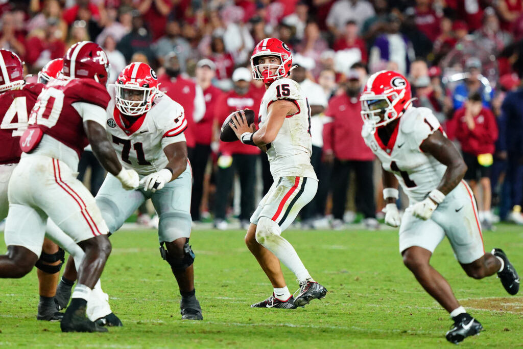 Georgia Bulldogs quarterback Carson Beck drops back to throw against the Alabama Crimson Tide during the fourth quarter at Bryant-Denny Stadium.