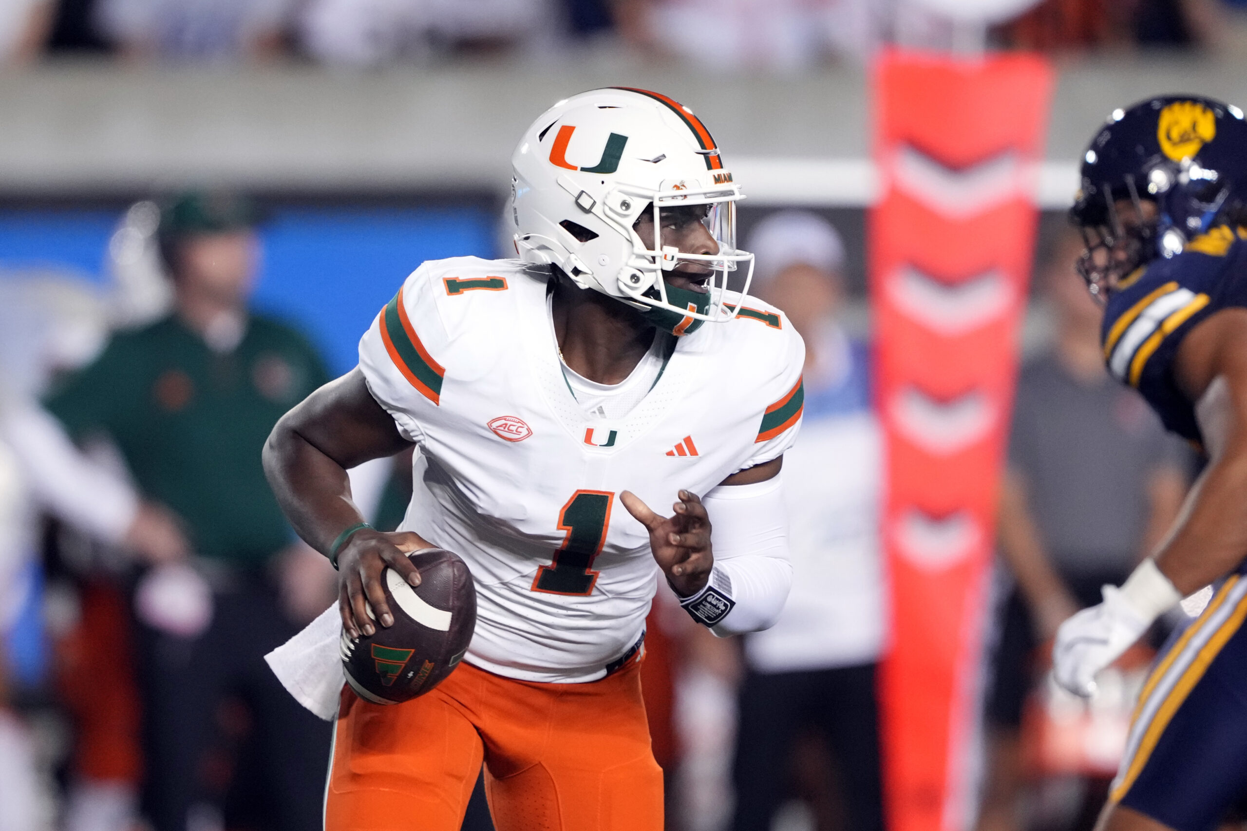 "Miami Hurricanes quarterback Cam Ward scrambles against California Golden Bears, Oct 5, 2024, at California Memorial Stadium"