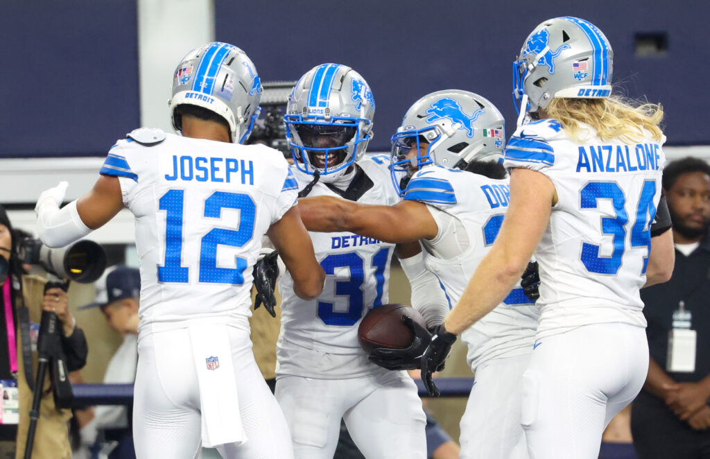 Detroit Lions safety Kerby Joseph (31) celebrates with teammates after an interception during the second half against the Dallas Cowboys at AT&T Stadium. 