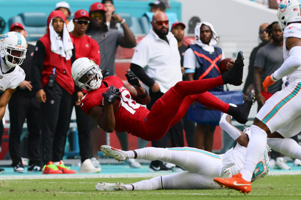 Arizona Cardinals wide receiver Marvin Harrison Jr. (18) makes a catch against Miami Dolphins safety Jevon Holland (8) during the first quarter at Hard Rock Stadium. 