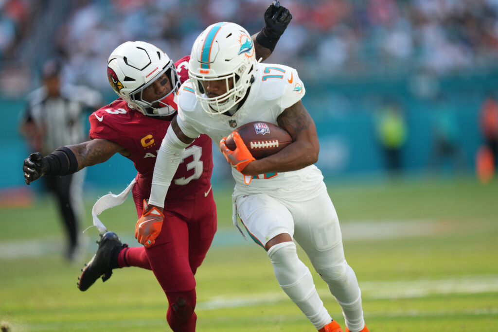 
Miami Dolphins wide receiver Jaylen Waddle catches a pass in the fourth quarter as Arizona Cardinals safety Budda Baker closes in on the play at Hard Rock Stadium. 