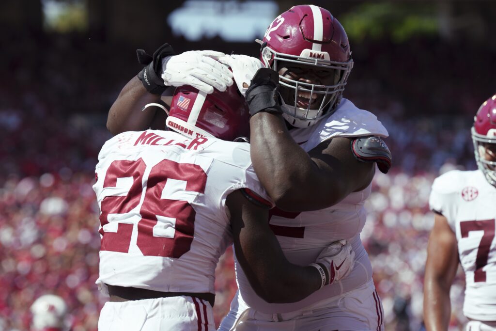 Alabama Crimson Tide running back Jam Miller (26) is greeted by offensive lineman Tyler Booker (52) after scoring a touchdown during the third quarter against the Wisconsin Badgers at Camp Randall Stadium. Mandatory Credit: Jeff Hanisch-Imagn Images