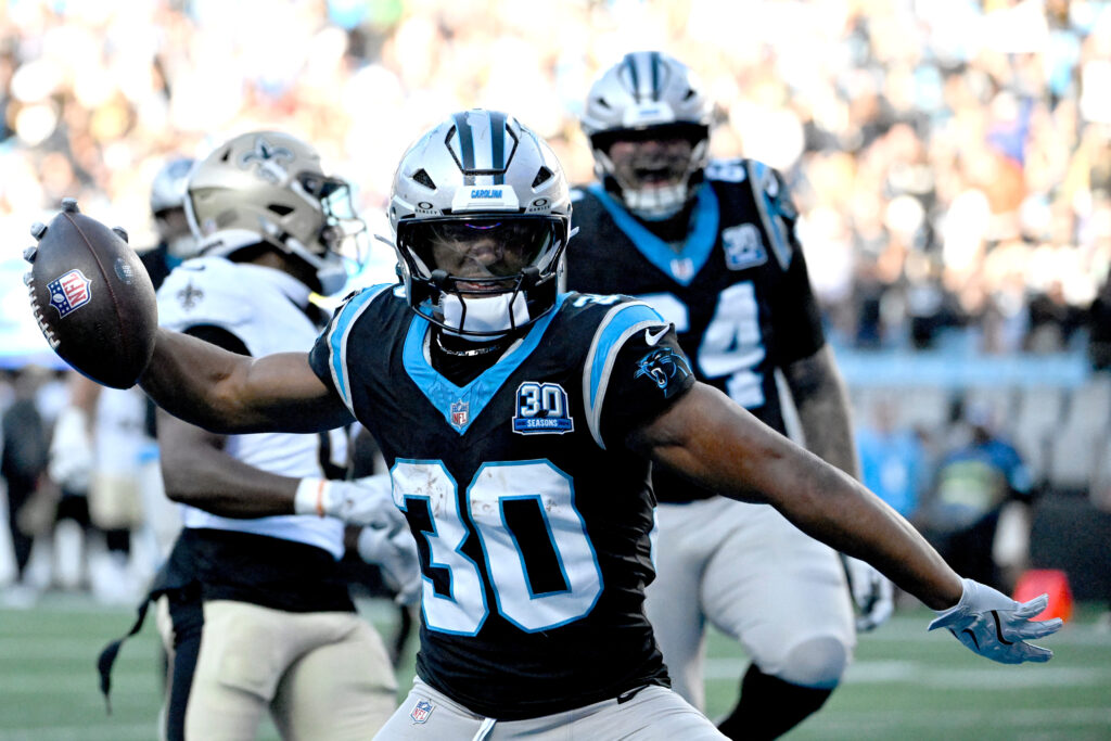 Carolina Panthers running back Chuba Hubbard (30) celebrates after scoring the winning touchdown in the fourth qarter at Bank of America Stadium. 
