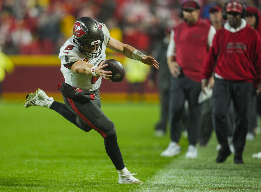 Tampa Bay Buccaneers quarterback Baker Mayfield (6) runs out of bounds during the second half against the Tampa Bay Buccaneers at GEHA Field at Arrowhead Stadium