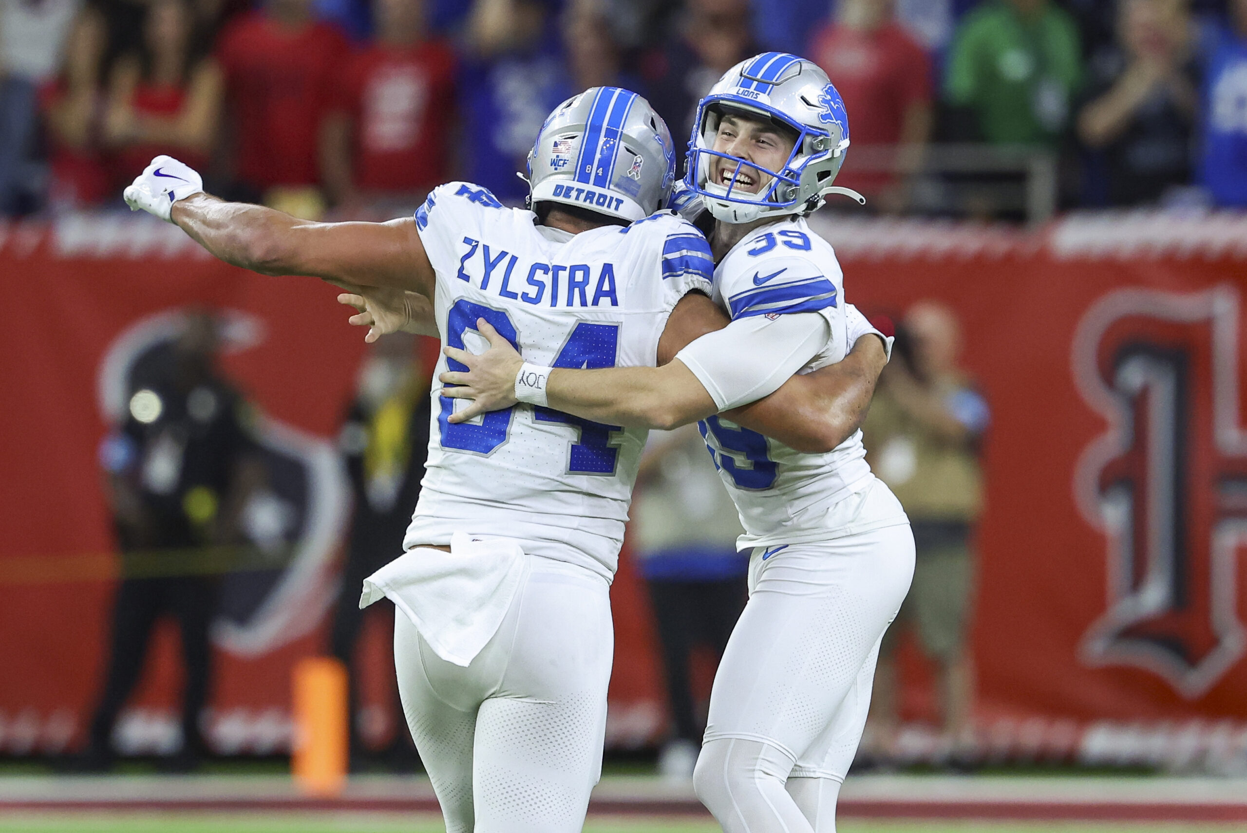 Detroit Lions place kicker Jake Bates celebrates with tight end Shane Zylstra after kicking a field goal with time expiring to give the Lions a win over the Houston Texans at NRG Stadium.