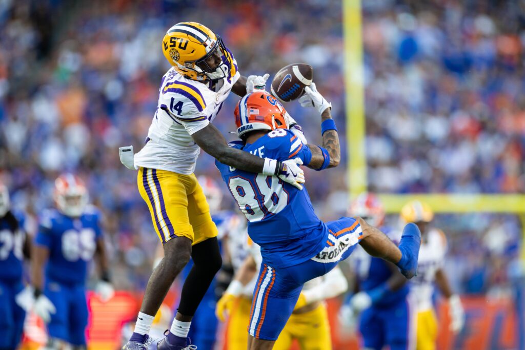 LSU Tigers cornerback Zy Alexander (14) breaks up a pass to Florida Gators wide receiver Marcus Burke (88) during the first half at Ben Hill Griffin Stadium.