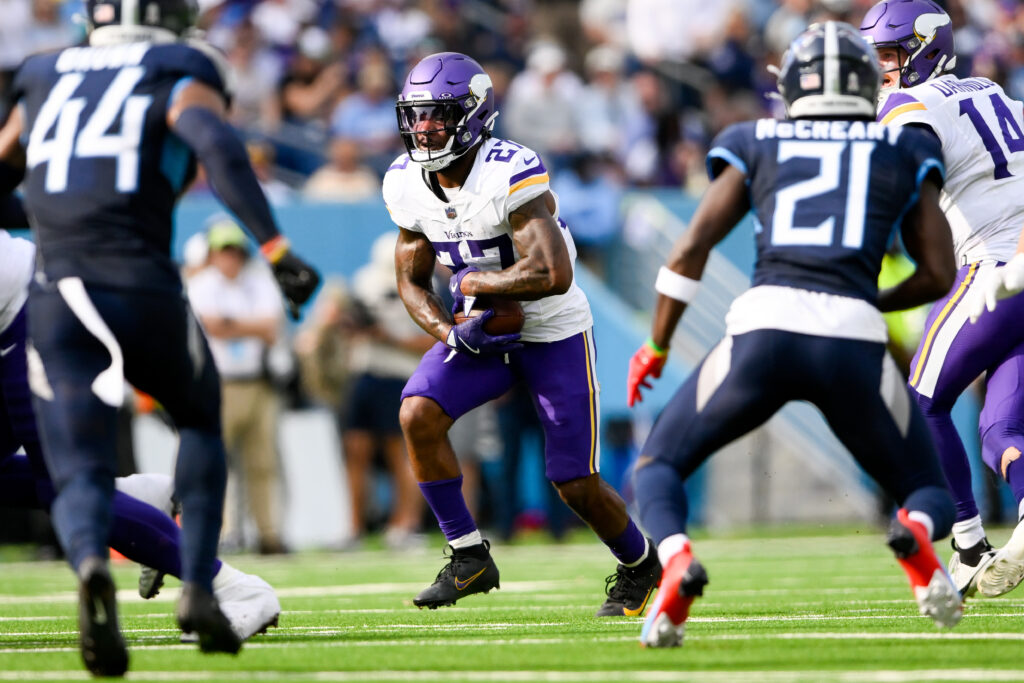 Minnesota Vikings running back Cam Akers (27) runs the ball against the Tennessee Titans during the first half at Nissan Stadium. 
