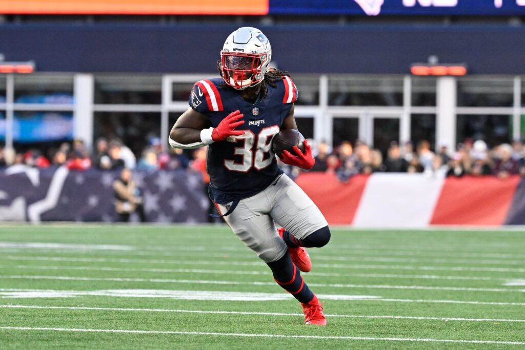 New England Patriots running back Rhamondre Stevenson (38) runs the ball against the Los Angeles Rams during the second half at Gillette Stadium.