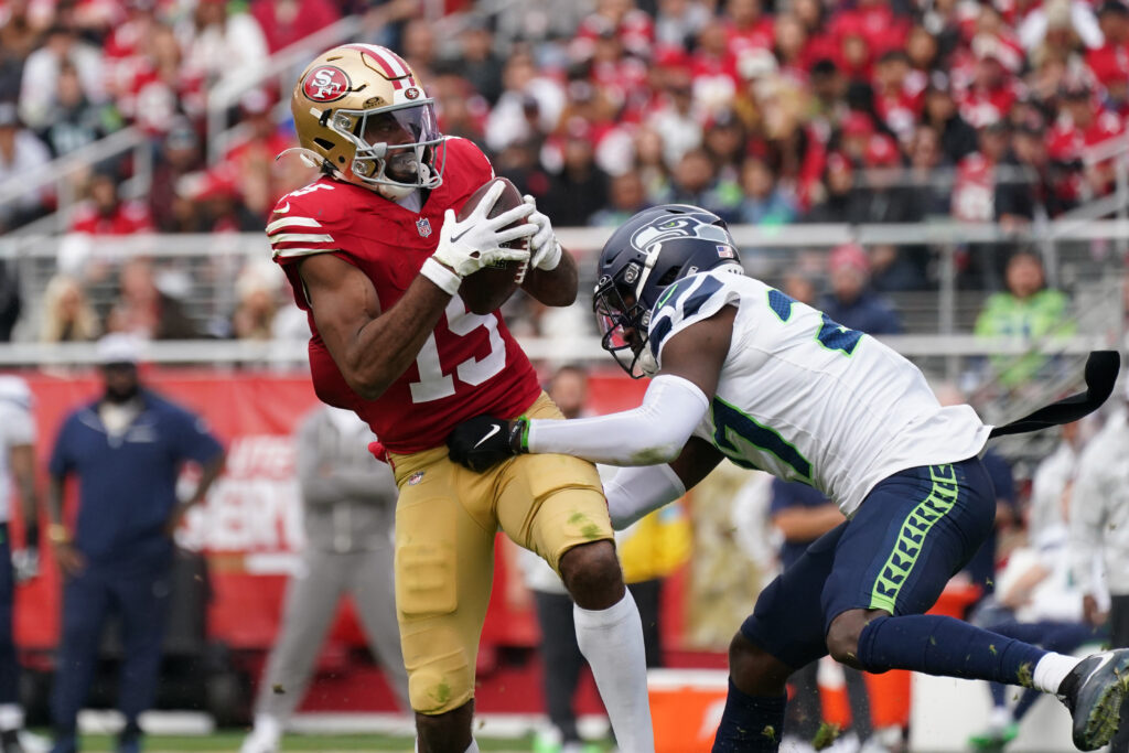 San Francisco 49ers wide receiver Jauan Jennings (15) makes a reception while defended by Seattle Seahawks cornerback Riq Woolen (27). 