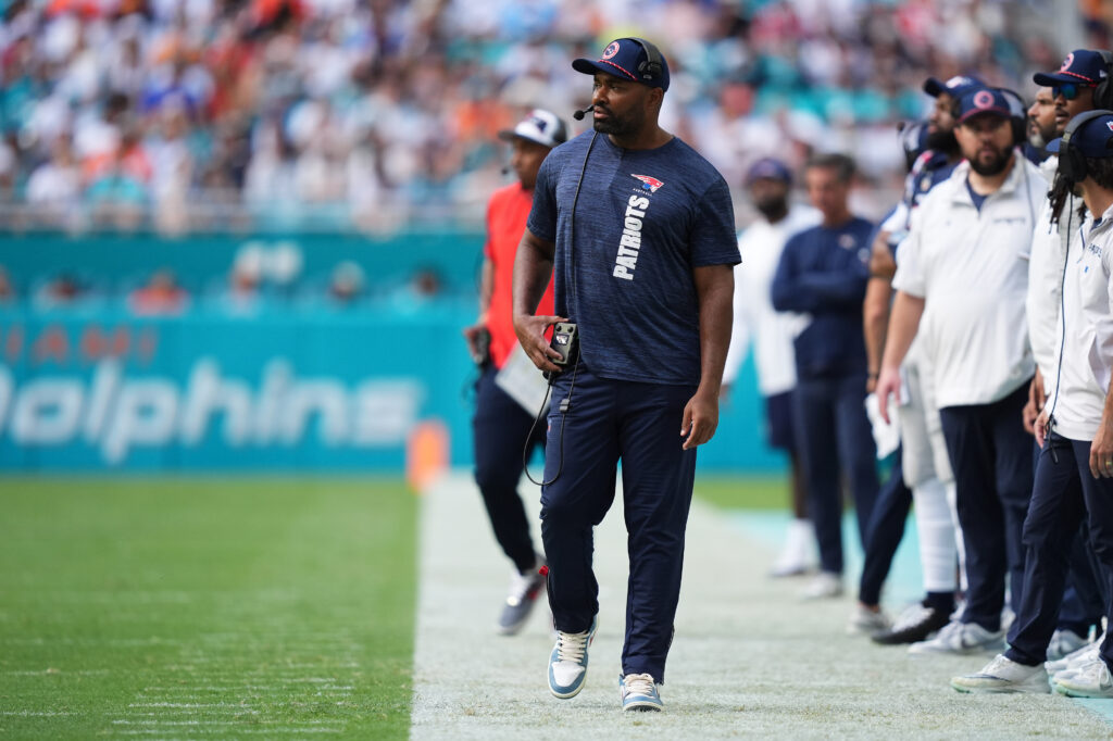 New England Patriots head coach Jerod Mayo walks down the sideline during the first half against the Miami Dolphins at Hard Rock Stadium. 