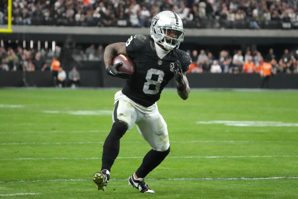Las Vegas Raiders running back Ameer Abdullah (8) carries the ball in the first quarter against the Denver Broncos at Allegiant Stadium. 