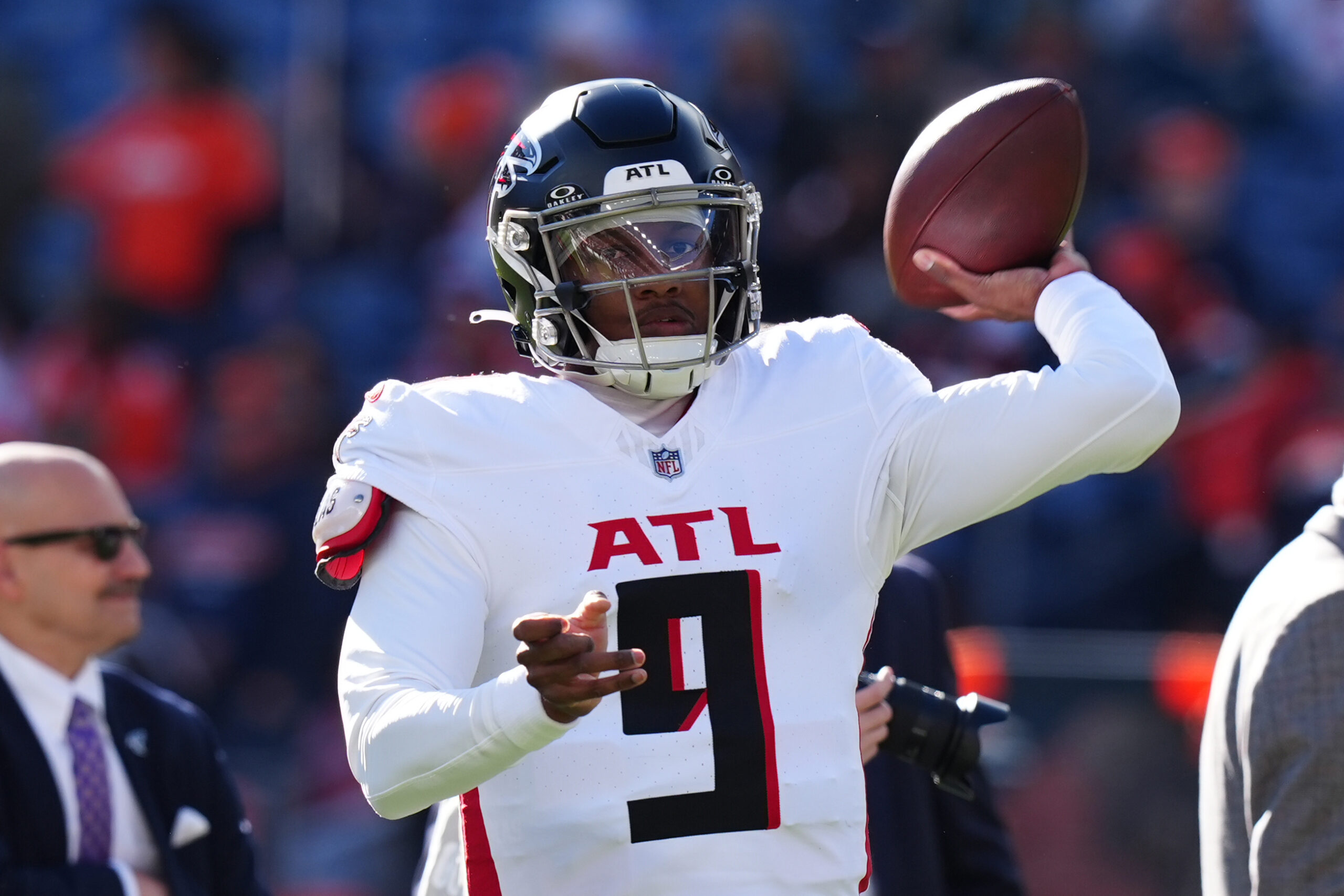 Atlanta Falcons quarterback Michael Penix Jr. (9) warms up before the game against the Denver Broncos at Empower Field at Mile High.