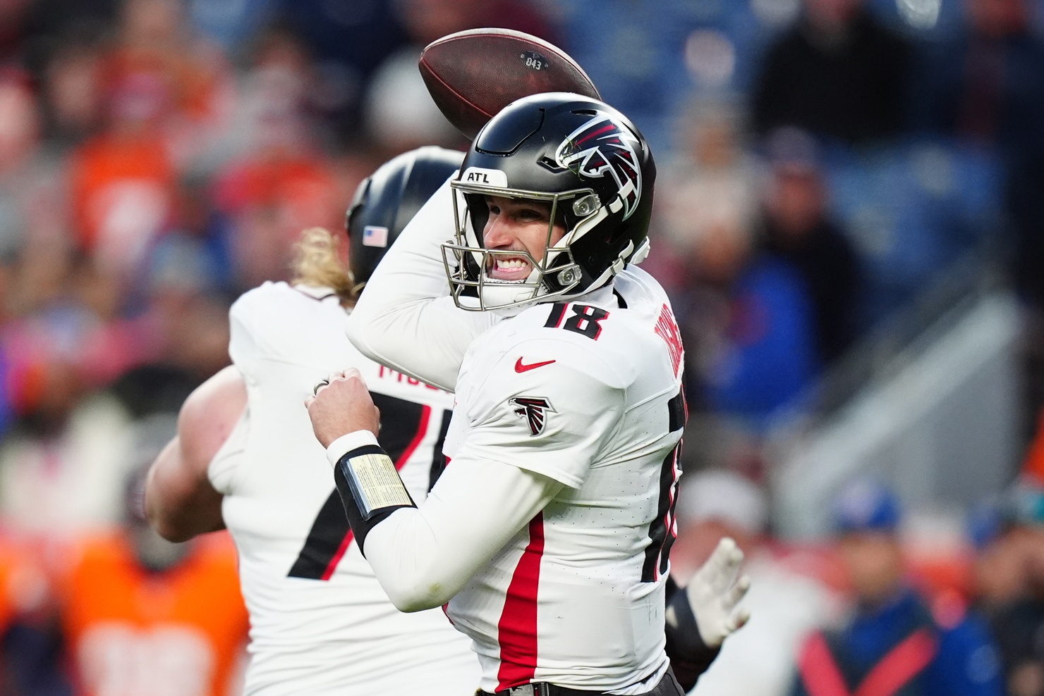 Atlanta Falcons quarterback Kirk Cousins (18) prepares to pass the ball in the fourth quarter against the Denver Broncos at Empower Field at Mile High.